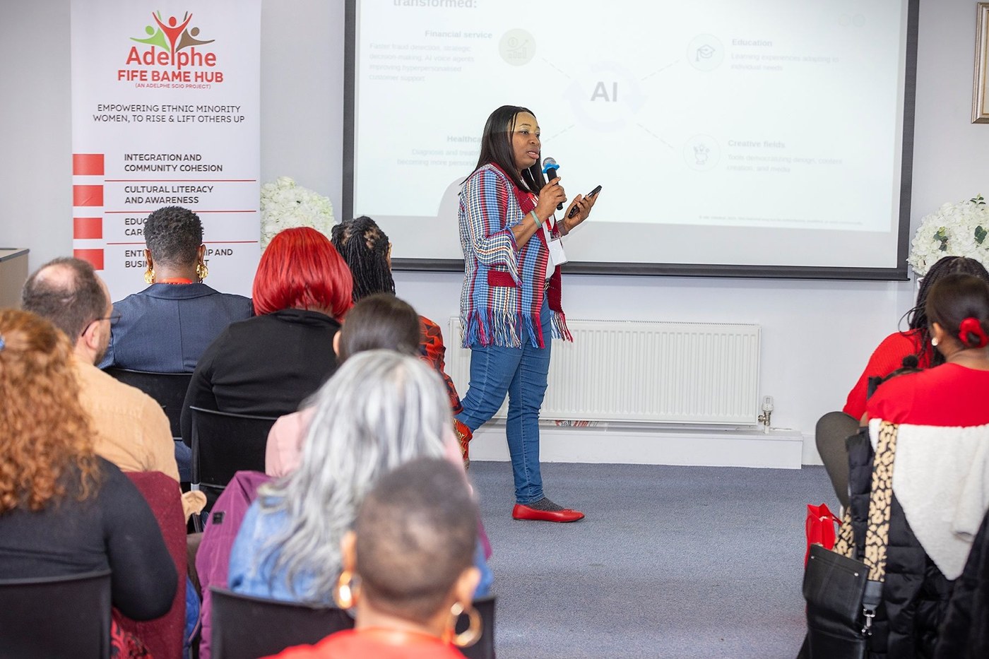 Abi Odedeyi speaking on stage about AI for business